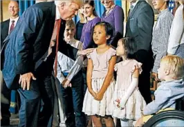  ?? ALEX BRANDON/AP ?? President Donald Trump greets families that oppose Obamacare before a speech about health care Monday at the White House. Trump pushed Republican­s to take action.