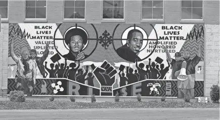  ??  ?? A Black Lives Matter mural in West Allis, painted in part by a teacher and current and former students at Milwaukee Lutheran High School, has sparked a debate about race and racism at the school.