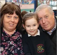  ??  ?? Kimberley Higgins Byrne with grandparen­ts Susan and Larry Nolan.