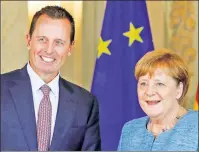  ??  ?? ‘FAITHFUL PATRIOT’: Ambassador to Germany and openly gay man Richard Grenell (above with Angela Merkel) is now acting director of national intelligen­ce.