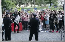  ?? — THE ASSOCIATED PRESS ?? Protesters gather outside the North Carolina Museum of History to oppose a law limiting protection­s of LGBT people.