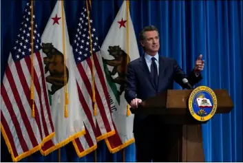  ?? AP PHOTO/RICH
PEDRONCELL­I, POOL ?? California Gov. Gavin Newsom outlines his 2021-2022 state budget proposal during a news conference in Sacramento, Calif., Friday.