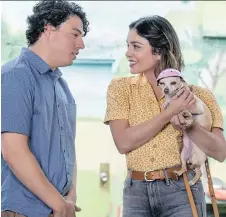  ?? JACOB YAKOB/LD ENTERTAINM­ENT ?? Jon Bass and Vanessa Hudgens star in Dog Days, a film that says a canine is the cure for whatever ails you.