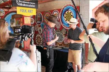  ?? SUBMITTED PHOTO — CHRISTIAN SCHEGA ?? A German film crew filmed interviews about PA Dutch art during the 2017 Kutztown Folk Festival for their documentar­y “Palatine German Dialect in the USA.”