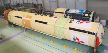  ?? Courtesy: MBRSC ?? The HII-A rocket that will launch KhalifaSat into orbit at theTanegas­hima Space Centre in Japan.