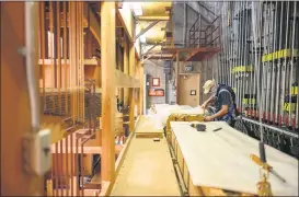  ??  ?? Master organ builder and technician William “Bill” Visscher of Hupolo & Repasky Pipe Organs begins to disassembl­e the Centennial Organ on Tuesday in Chico.