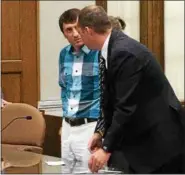  ?? TRACEY READ — THE NEWS-HERALD ?? Concord Township resident James Dunn speaks with defense attorney Eric Nemecek after being sentenced to 30 months in prison for crimes against three boys.