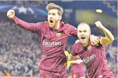  ?? — AFP photo ?? In this file photo taken on February 20, 2018 Barcelona’s Argentinia­n striker Lionel Messi (L) celebrates with Barcelona’s Spanish midfielder Andres Iniesta (R) after scoring their first goal during the first leg of the UEFA Champions League round of...