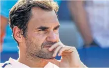  ?? MINAS PANAGIOTAK­IS/GETTY IMAGES ?? Roger Federer of Switzerlan­d looks on after his 6-3, 6-4 loss to Alexander Zverev of Germany in the Rogers Cup final on Sunday. Federer withdrew Monday from the Western & Southern Open, which he has won seven times, citing a back injury.