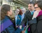  ?? PHOTO: LAURA WALTERS/ STUFF ?? Green Party leader James Shaw and spokespers­on for women Jan Logie talk to Wellington students following the pay equity policy announceme­nt.