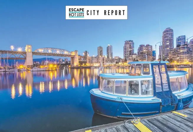  ?? ?? The Vancouver waterfront and harbour illuminate­d at night. Picture: Getty