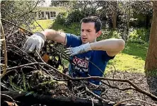  ?? DAVID UNWIN/ FAIRFAX NZ. ?? BNZ worker Ryan Golledge takes time out from his day job as part of Closed for Good to help out in the community