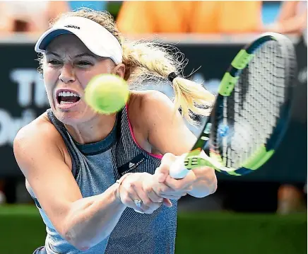  ?? PHOTO: PHOTOSPORT ?? Caroline Wozniacki hits a backhand during her straight-sets win over Petra Martic in Auckland yesterday.