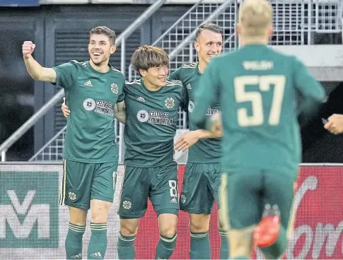  ??  ?? HOOPS JOY: Kyogo Furuhashi celebrates with team-mates in the Europa League play-off match against AZ Alkmaar.