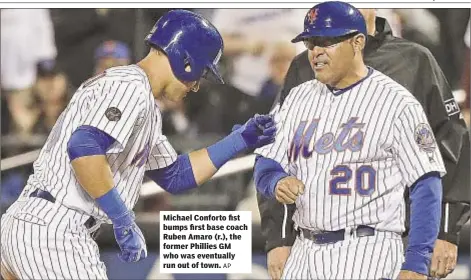  ?? AP ?? Michael Conforto fist bumps first base coach Ruben Amaro (r.), the former Phillies GM who was eventually run out of town.