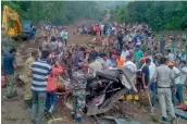  ?? — AP ?? Army soldiers and rescue workers search for bodies after a landslide in Himachal Pradesh on Sunday.