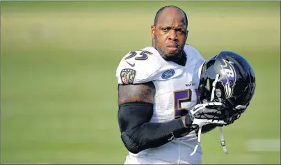  ?? AP PHOTO ?? In this Aug. 2 file photo, Baltimore Ravens outside linebacker Terrell Suggs walks on the field during an NFL training camp practice in Owings Mills, Md.