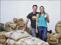  ?? BRUCE R. BENNETT / THE PALM BEACH POST ?? Virgin Islands Coffee Roasters co-founders Cathy and Ramsey Smith pose for a portrait with sacks of green coffee beans at their facility in Boynton Beach.