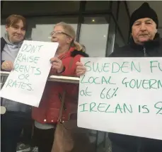  ??  ?? Protestors making their point outside County Hall, Riverside on Monday in advance of the county council meeting. Ann McArdle, Lily Colburn, Michael McLoughlin from Cartron estate and Forthill protesting outside County Hall on Monday.