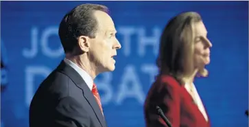  ?? Matt Rourke Associated Press ?? REPUBLICAN SEN. Patrick J. Toomey and Democrat Katie McGinty debate in Philadelph­ia on Monday. He again declined to answer repeated questions about whether he would vote for Donald Trump.