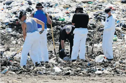  ?? Gavin Young/Calgary Herald ?? Police search an area of the Spyhill landfill Wednesday for evidence in the disappeara­nce of Nathan O’Brien, 5, and his grandparen­ts.