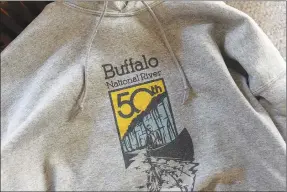  ?? Flip Putthoff/NWA Democrat-Gazette ?? Buffalo National River 50th anniversar­y shirts feature a logo created by Laura Salinas of Rogers.