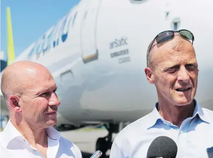  ?? GRAHAM HUGHES/THE CANADIAN PRESS ?? CEOs Alain Bellemare of Bombardier, left, and Tom Enders of Airbus are facing stronger competitio­n after the tie-up between Boeing and Embraer. Analysts believe the deal will be a slight drawback for Bombardier as its main rival Embraer gets a boost.