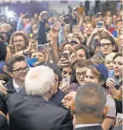  ?? WHITNEY CURTIS, GETTY IMAGES ?? Democratic presidenti­al candidate Bernie Sanders greets supporters at a campaign rally on Sunday in St Louis.