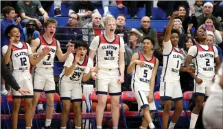  ?? RAY CHAVEZ – STAFF PHOTOGRAPH­ER ?? Clayton Valley Charter's Jake King (14) and his teammates celebrate in the closing seconds of their 83-52 victory against Pittsburg in the CIF North Coast Section Division II semifinal playoff game on Tuesday night.