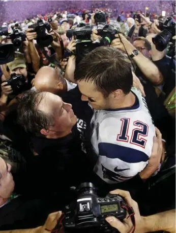  ?? CHRISTIAN PETERSEN/GETTY IMAGES ?? Sensationa­l reports of behind-the-scenes turmoil change the tone of the Patriots’ pursuit of a sixth Super Bowl triumph, with coach Bill Belichick and star QB Tom Brady at the helm.