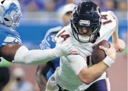  ?? JOSE M. OSORIO/CHICAGO TRIBUNE ?? Bears quarterbac­k Andy Dalton runs for 9 yards in the fourth quarter against the Lions on Nov. 25 at Ford Field in Detroit. The Bears won 16-14.