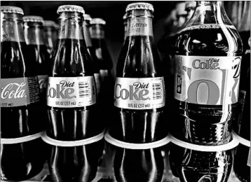  ?? JOE RAEDLE/GETTY 2014 ?? Some studies have raised concerns about the long-term health consequenc­es of drinking so many diet Cokes.