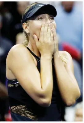  ??  ?? Maria Sharapova of Russia reacts after beating Simona Halep of Romania during their first round match Monday. (Reuters)