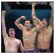  ?? (AP/Matthias Schrader) ?? The United States’ 400-relay team of Bowe Becker (left), Blake Pieroni and Caeleb Dressel celebrate after winning the gold medal at the Tokyo Olympics.