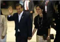  ?? The Associated Press ?? MONEY LAUNDERING: Peru's President Ollanta Humala waves to the press while arriving with his wife, Nadine Heredia, to the closing ceremony of the Business Summit in Paracas, Peru, on July 2. On Tuesday, Peruvian prosecutor­s asked for jail for the...