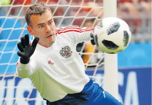  ?? Picture: KAI PFAFFENBAC­H/REUTERS ?? FOCUSED APPROACH: Russia's Igor Akinfeev during the World Cup host team’s training session at Luzhniki Stadium, Moscow