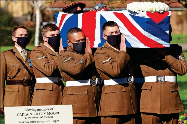  ??  ?? HELD HIGH: Sir Tom’s coffin was borne by soldiers from the Yorkshire Regiment, with another 14 providing a gun salute