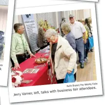  ?? Keith Bryant/The Weekly Vista Weekly Vista Keith Bryant/The ?? Austin Simpson, commercial loan of the Ozarks, officer with cooks hotdogs Bank for the Bella Business Associatio­n Vista business fair. Jerry Varner, left, talks with business fair attendees.