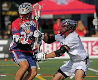  ?? STUART CAHILL / BOSTON HERALD ?? NO GO: Cannons midfielder Challen Rogers runs into Atlanta’s Matt Whitcher during yesterday’s game.