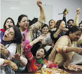  ?? ARIF ALI / AFP / GETTY IMAGES ?? Activists celebrate the decision against Prime Minister Nawaz Sharif in Lahore on Friday. Pakistan’s Supreme Court disqualifi­ed Sharif from public office.