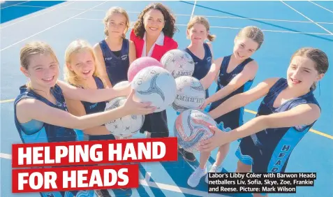  ?? Picture: Mark Wilson ?? Labor‘s Libby Coker with Barwon Heads netballers Liv, Sofia, Skye, Zoe, Frankie and Reese.