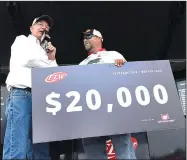  ?? NWA Democrat-Gazette/FLIP PUTTHOFF ?? Bill Taylor (left), tournament director, congratula­tes Charley Slaton of Valliant, Okla., on his co-angler division win Friday at the FLW Tour Bass Tournament at Beaver Lake.