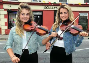  ??  ?? Talented musicians and twin sisters Niamh and Siobhan O’Sullivan getting into the spirit of things ahead of Scully’s Fest in Newmarket, which is set to take place from August 10-14.