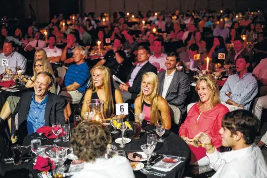  ?? STAFF PHOTOS BY DOUG STRICKLAND ?? People listen as Atlanta Falcons linebacker Vic Beasley answers questions at the Times Free Press Best of Preps Banquet at the Chattanoog­a Convention Center on Tuesday.