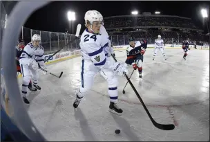  ?? AP PHOTO/NICK WASS ?? In this picture taken with a fisheye lens, Toronto Maple Leafs right wing Kasperi Kapanen (24), of Finland, chases the puck against Washington Capitals center Jay Beagle (83) during the third period of an NHL hockey game, Saturday in Annapolis, Md. The...