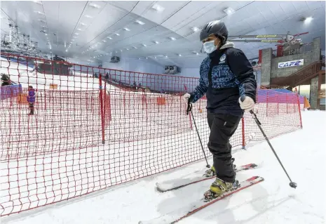  ?? Antonie Robertson / The National ?? Ski Dubai welcomed back customers to its pistes at Mall of the Emirates yesterday after the government eased restrictio­ns on entertainm­ent, cinemas and gyms to restore the emirate’s economic activity