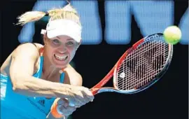  ?? Dita Alangkara Associated Press ?? ANGELIQUE KERBER returns a shot during her 6-2, 6-7 (3), 6-2 win over fellow German Carina Witthoeft in the second round of the Australian Open.