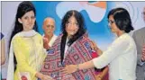  ?? KARUN SHARMA/HT ?? Pakistan delegates felicitate Manipuri activist Irom Sharmila at the Youth Peace Festival in Chandigarh on Wednesday.