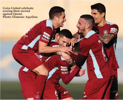  ??  ?? Gzira United celebrate scoring their second against Qormi Photo: Domenic Aquilina