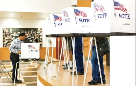  ?? Imperial residents take to the polls to cast their votes in the 2018 Primary Election on Tuesday at T.L. Waggoner Elementary School in Imperial. VINCENT OSUNA PHOTO ??